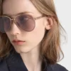 Prada Sunglasses with the Iconic Metal Plaque
